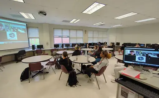 Hilke speaks to a group of students at Benedictine