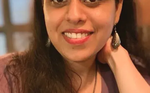 Headshot of Shagun wearing a purple shirt
