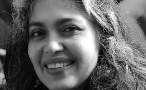 Black and white headshot of Beena