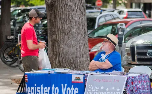Voter registration table. Image by Michaela Warthen/Shutterstock.