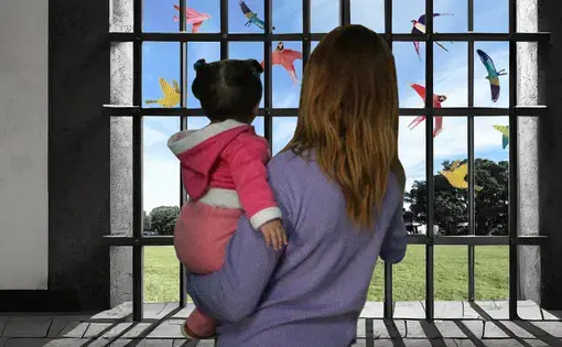An illustration of a woman holding a child behind bars