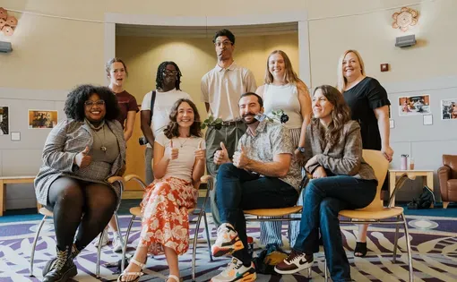 A group of people pose for a photo