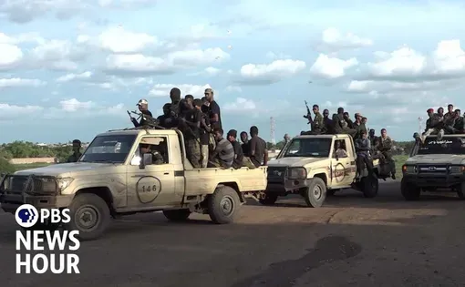 soldiers in pick-up trucks in Sudan