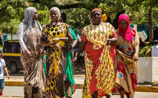 Four women in traditional African clothing