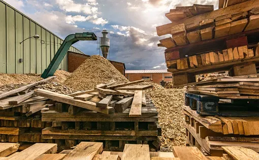 Outdoor pallet recycling sawmill plant for pellet processing using machinery. Image by Juan Enrique del Barrio/Shutterstock.