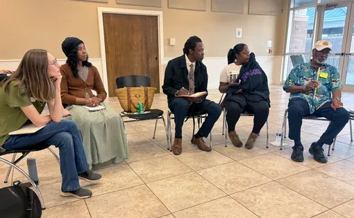 people sit in a circle at a Mississippi Free Press event