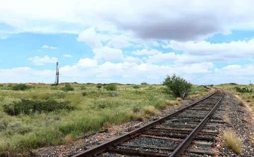 West Texas landscape with pulling unit and railroad