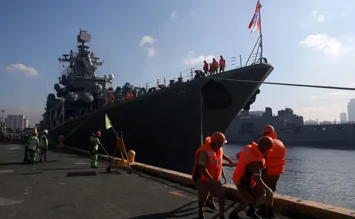 Seafarers prepare to dock a Russian missile cruiser in Metro Manila, Philippines, January 6, 2019.
