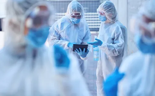 a group of people in uniform PPE