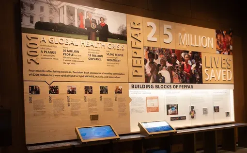 Display about PEPFAR, the President's Emergency Plan for AIDS Relief founded by George W. Bush. The exhibit is in the George W. Bush Presidential Library. Image by Teresa Otto/Shutterstock.com.