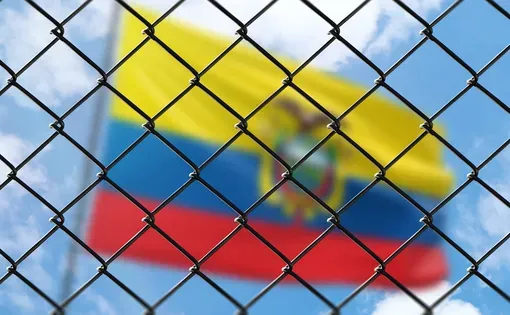 Ecuador flag behind a fence