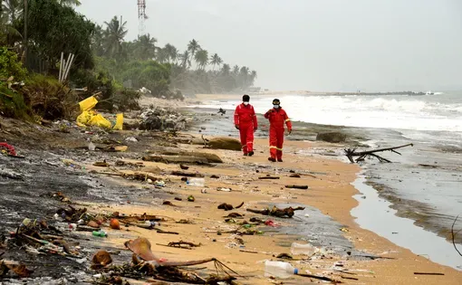 Sri Lankan navy soldiers are seen working in a beach in Pamunugama western province Sri Lanka for the removal of debris washed ashore from the burned container ship MV X-Press Pearl. 5th June 2021
