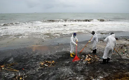Sri Lankan navy soldiers are seen working in a beach in Pamunugama western province Sri Lanka for the removal of debris washed ashore from the burned container ship MV X-Press Pearl. 5th June 2021
