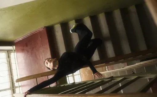 Ukrainian woman dances in stairwell