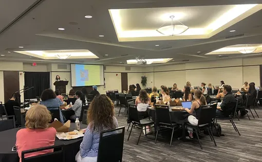 Jasmine Aguilera talking to a group of students