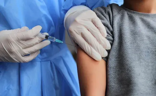 Child receiving a vaccine