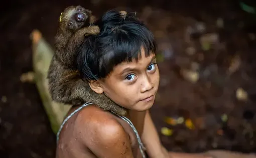 An Indigenous Korubo boy in the Amazon rainforest