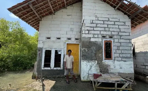 Man standing in front of home