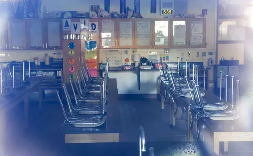Classroom with chairs on desks