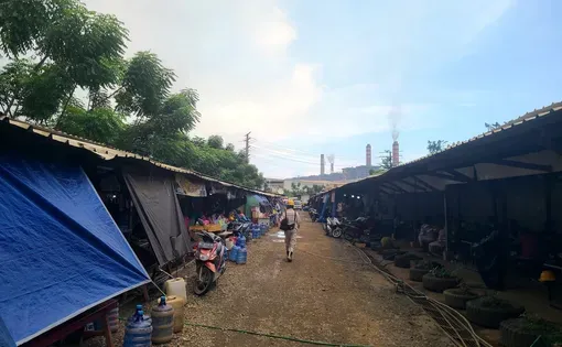 A commercial street frequented by Chinese and Indonesian workers near the entrance of the industrial compound in Weda Bay, North Maluku, Indonesia.