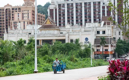 High-rise buildings stand in the Boten Special Economic Zone in northern Laos, near the border with China. The area is suspected to be a hotspot for scam operations, including schemes that store fraudulent money in crypto for later laundering.