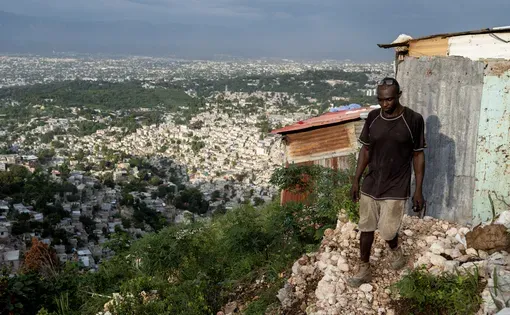A man looking down at his feet