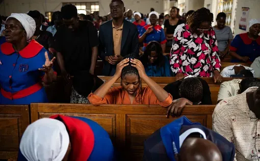 People pray in church