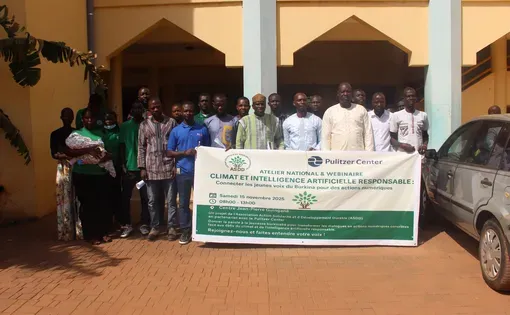 People standing in front of banner