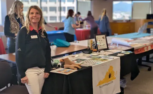 Public health educator Jenny Hall and her display at an event for adults learning English.