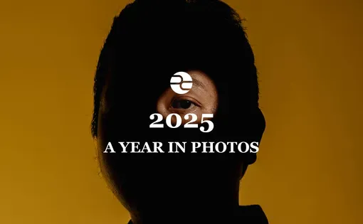 2025 Year in Photos, Pulitzer Center. superimposed over a photo of a man mostly obscured by light