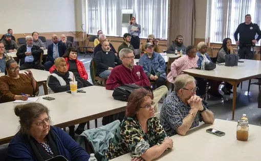Residents of Gary, McDowell County, and other observers listen during a West Virginia Public Service Commission hearing at the McDowell Armory in Welch on March 19, 2026.