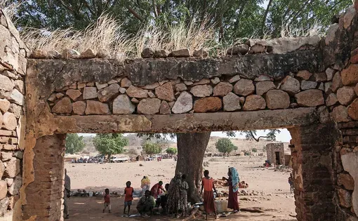Members of Intisar Abdullah Kodi's family cook in Korongo, Sudan.