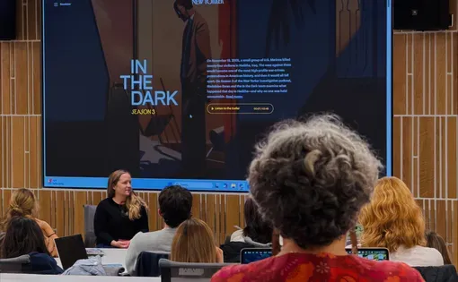 students listen to a visiting journalist lecture