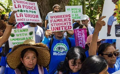 Hundreds of demonstrators marched two miles through Coral Gables on Friday to call attention to labor abuses in Florida’s plant nursery industry. Pedro Portal