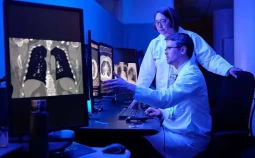 Dr. Lecia Sequist, here with Dr. Florian Fintelmann at Mass General Brigham Cancer Institute in Boston, helped develop an AI program that can “look” at a single CT scan and generate a “risk score” corresponding to the likelihood of the person developing cancer. Mass General Brigham Cancer Institute