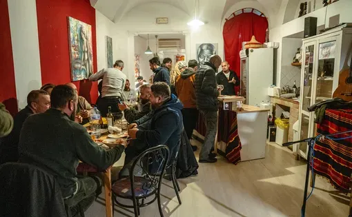 Patrons dine at Ristorante Mandela in Perugia, Italy, in 2024. Osman Taifour, of Sudan, opened Ristorante Mandela, the region’s first African restaurant, in 2019. “The restaurant wasn’t just a restaurant; it was a center of culture,” Taifour said. Image courtesy of Corso Garibaldi District. Italy, 2024.