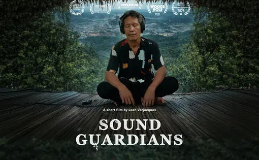Sound guardians cover. a man sits cross legged, eyes closed, ears covered by headphones. the forest in background.
