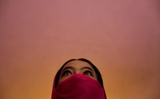 Barsha Magar, a former aid worker who turned to sex work to survive after losing her job amid the U.S. foreign aid cuts, poses for a photo.