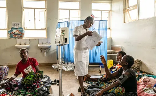Elicy Langton, a student nurse-midwife, attends to mothers and their newborn babies in the postnatal ward at the Kasungu District Hospital in Malawi.