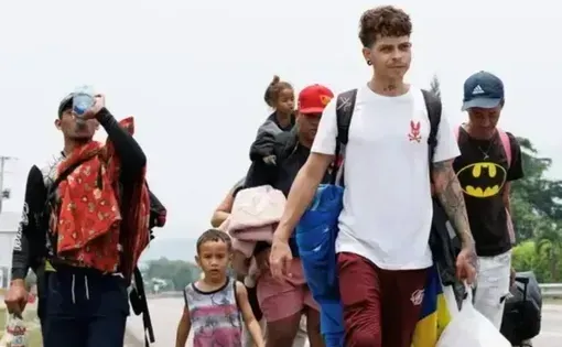 An immigrant family walks on a street