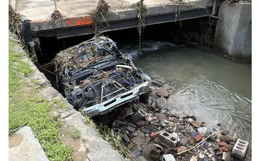 Tina Sanders of Dante, Virginia, survived after being sucked into the same flash flood waters that destroyed her truck (below). Such sudden weather events are becoming more difficult to predict because of climate change and a lack of local data.