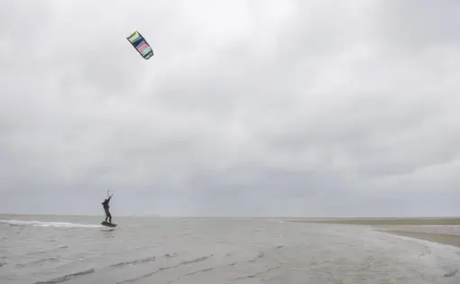 The Zandmotor, or Sand Motor, is popular among kitesurfers as well as traditional surfers. Image by Chris Granger. Netherlands, 2019.