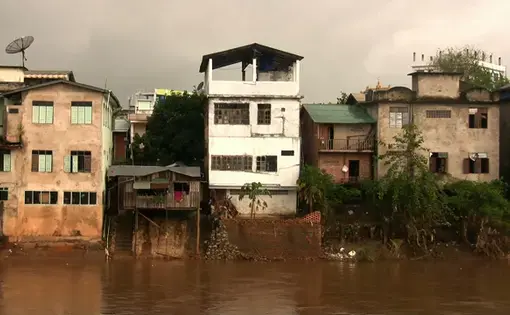 Houses on the Moei River in Mayawatti, Burma. Thailand, 2011.