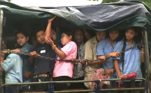 Burmese migrants heading by lorry to a garment factory. Thailand, 2011.