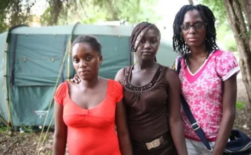 Phara, Malia and Edeline, three Haitian girls orphaned by HIV/AIDS who Lisa Armstrong interviewed during the summer of 2010. Image by Andre Lambertson. Haiti, 2010.