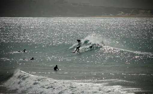 Surfers riding the waves in Morocco.