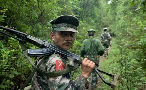 Kachin Independence Army fighters on patrol near the frontline, southern Kachin state. A Burmese Army outpost sits about a mile away from their forward outpost. Image by Jason Motlagh. Burma, June 2012. Media file: Kachin-burma-KIA.jpg