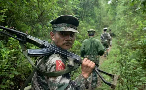 Kachin Independence Army fighters on patrol near the frontline, southern Kachin state. A Burmese Army outpost sits about a mile away from their forward outpost. Image by Jason Motlagh. Burma, June 2012. Media file: Kachin-burma-KIA_0.jpg