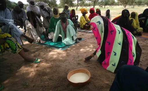 Habiza, a member of a 450-person tribe near Dakoro in east Niger, writes her name in the sand. She learned to read and write through a Lutheran World Relief program. The tribal women say knowing how to read helps them avoid getting scammed when they go to market. Niger, 2010.