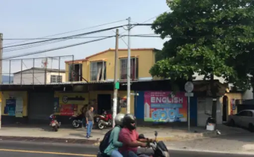 An English language school in San Salvador, called EnglishCool. Its founder, Eddie Anzora, prepares students for work in the call centers. Image by Jonathan Blitzer. El Salvador, 2016.